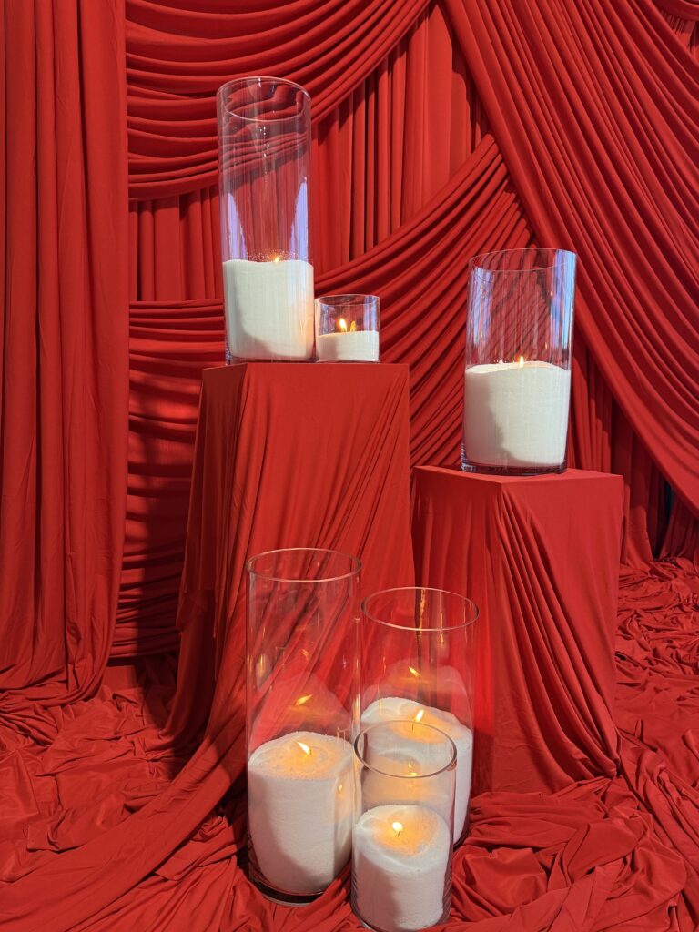 red draped pedestals
